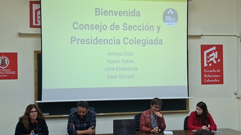 Mesa de bienvenida del encuentro anual de Coop57 Madrid en la Escuela de Relaciones Laborales de la Universidad Complutense